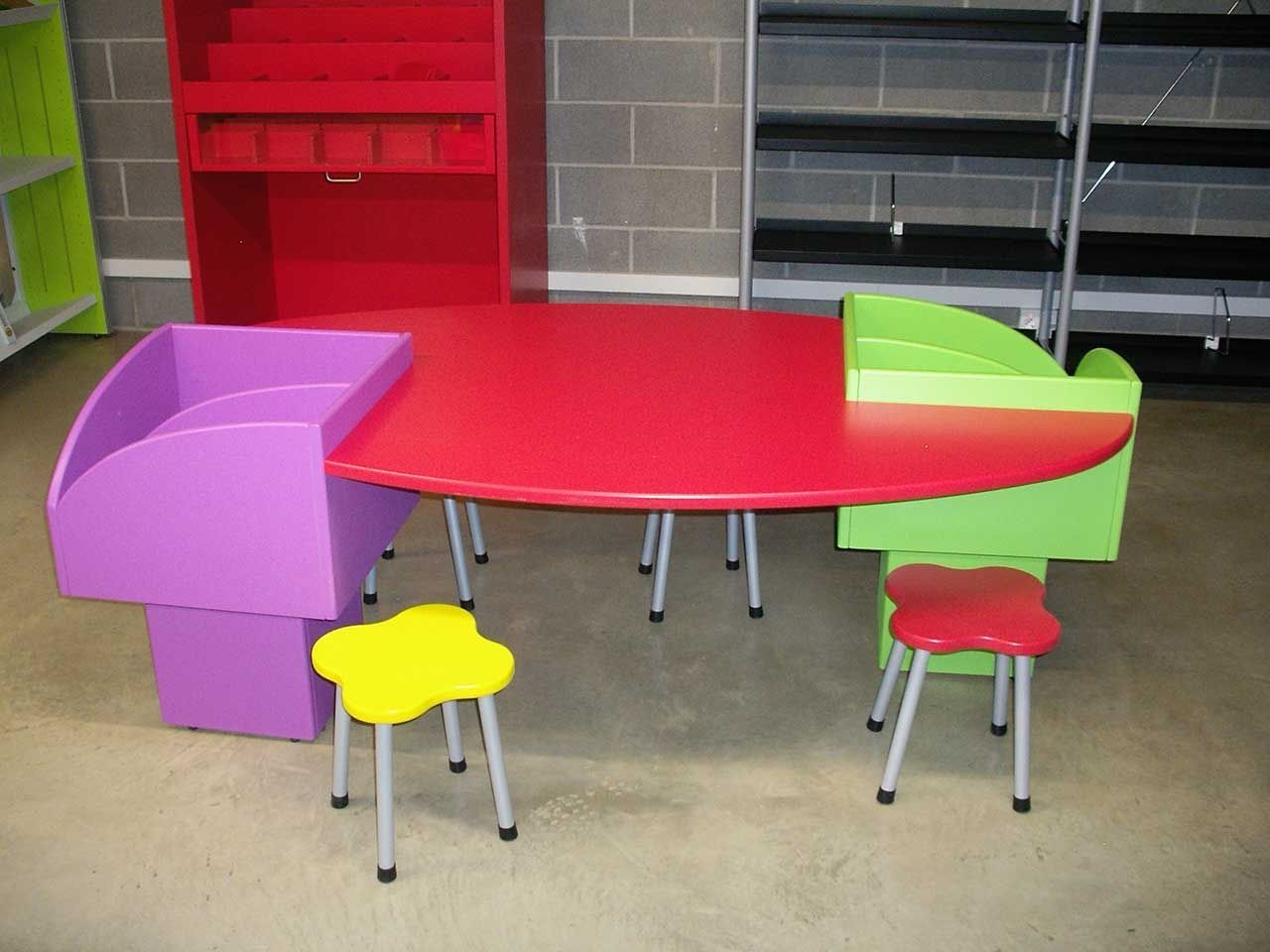 Oval table with storage container for tales